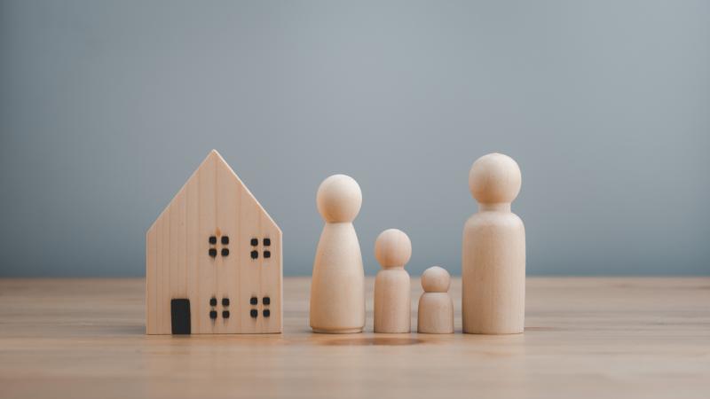 Wooden people with wooden house